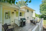 Back deck with outdoor furniture and fenced in yard